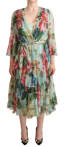 Green floral long sleeve V-neck midi dress by Dolce & Gabbana, featuring a fitted silhouette and elegant design.