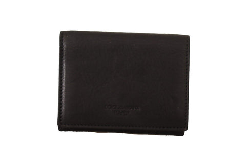 Black leather Dolce & Gabbana trifold purse with belt and multi-kit wallet, featuring detailed stitching and sleek design.