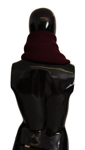 Dark red Dolce & Gabbana cashmere logo wrap shawl with knitted texture, draped to showcase its soft, luxurious fabric.