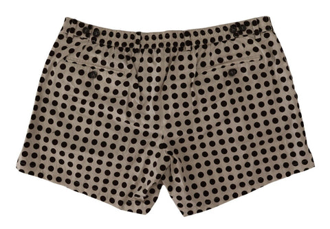 Black and white polka dot cotton linen shorts by Dolce & Gabbana, featuring a relaxed fit and stylish design.