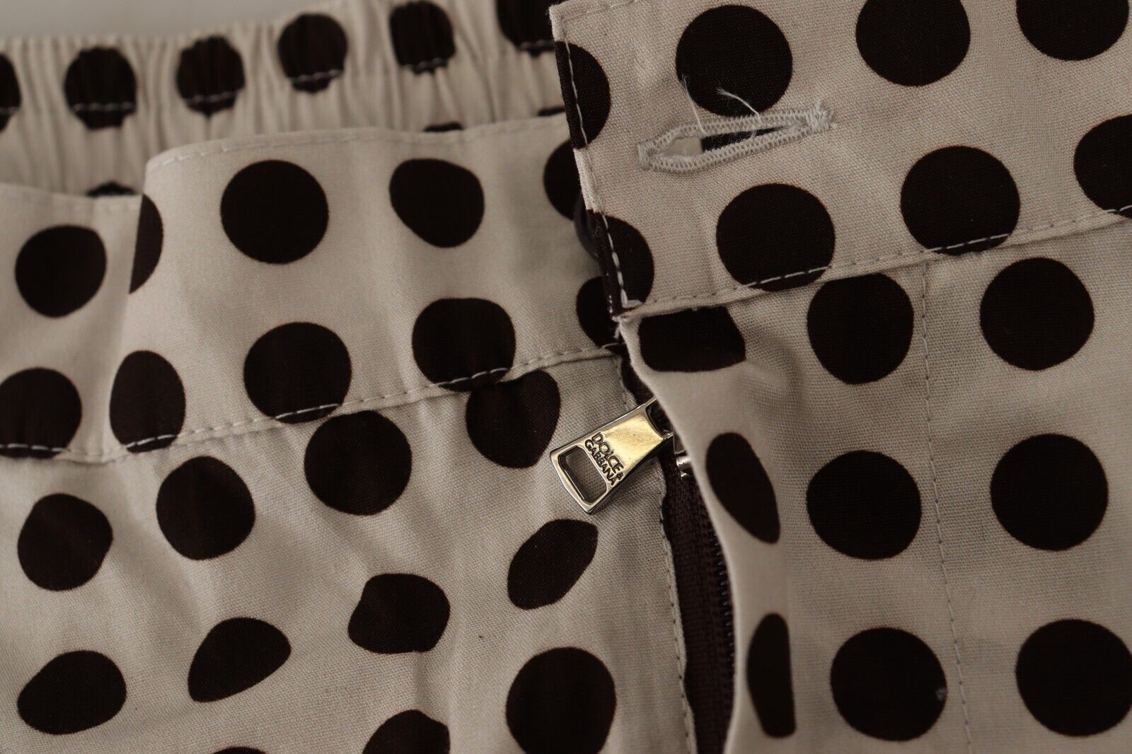 Black and white polka dot cotton linen shorts by Dolce & Gabbana, featuring a relaxed fit and stylish design.