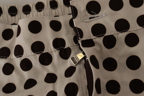 Black and white polka dot cotton linen shorts by Dolce & Gabbana, featuring a relaxed fit and stylish design.
