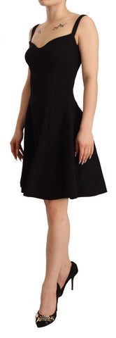Black fit flare wool stretch sheath dress by Dolce & Gabbana, featuring a tailored silhouette and elegant design.