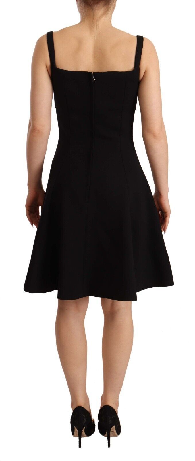 Black fit flare wool stretch sheath dress by Dolce & Gabbana, shown on a hanger with close-up fabric details.