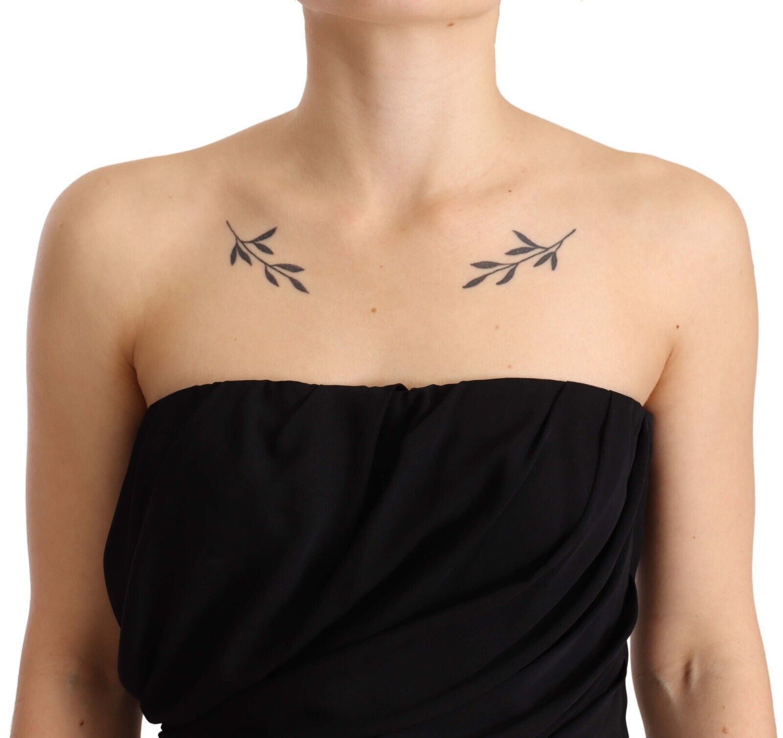 Black silk stretch strapless sheath midi dress by Dolce & Gabbana, shown on a model with elegant draping and fitted silhouette.