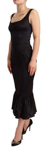 Black silk stretch sheath mermaid midi dress by Dolce & Gabbana, shown with fitted bodice and flared hem.