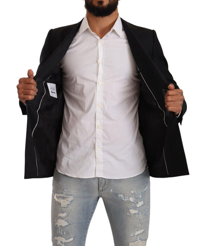 Black dotted double-breasted Martini jacket by Dolce & Gabbana with tailored fit and stylish lapels, shown on a model.