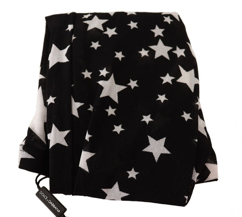 Black nylon stockings with white star print by Dolce & Gabbana, featuring a sheer, smooth texture and star pattern design.