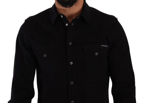 Black slim cotton denim stretch shirt by Dolce & Gabbana, showing close-up of fitted shirt fabric and button details.