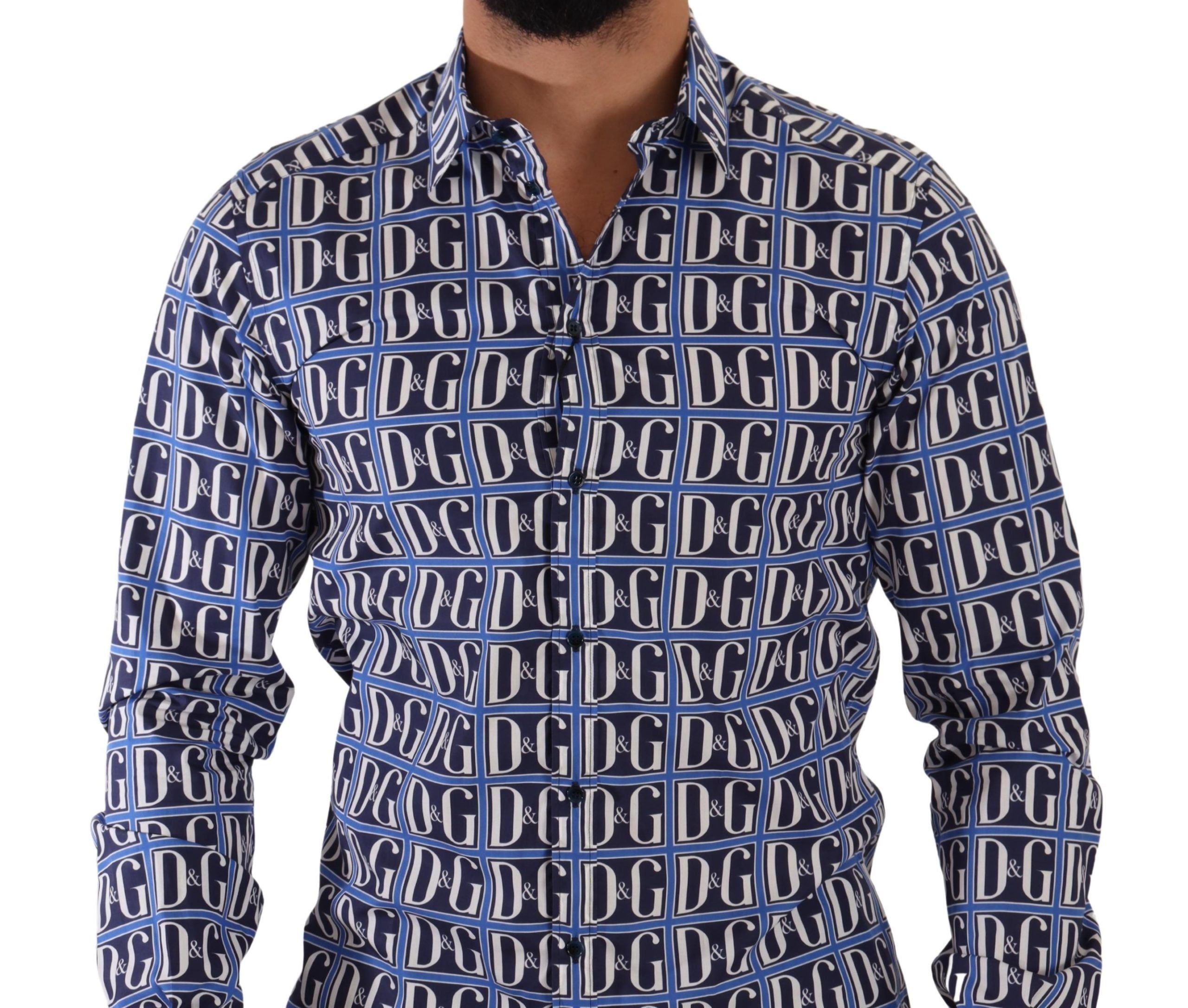 Blue Dolce & Gabbana Logo Mania slim fit cotton shirt displayed on a hanger, featuring a prominent logo design and classic collar.