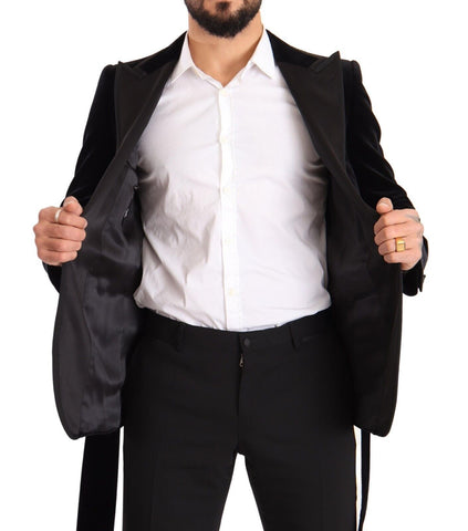 Black velvet Dolce & Gabbana single-breasted blazer with one button, tailored fit, and classic lapel, shown on a hanger.