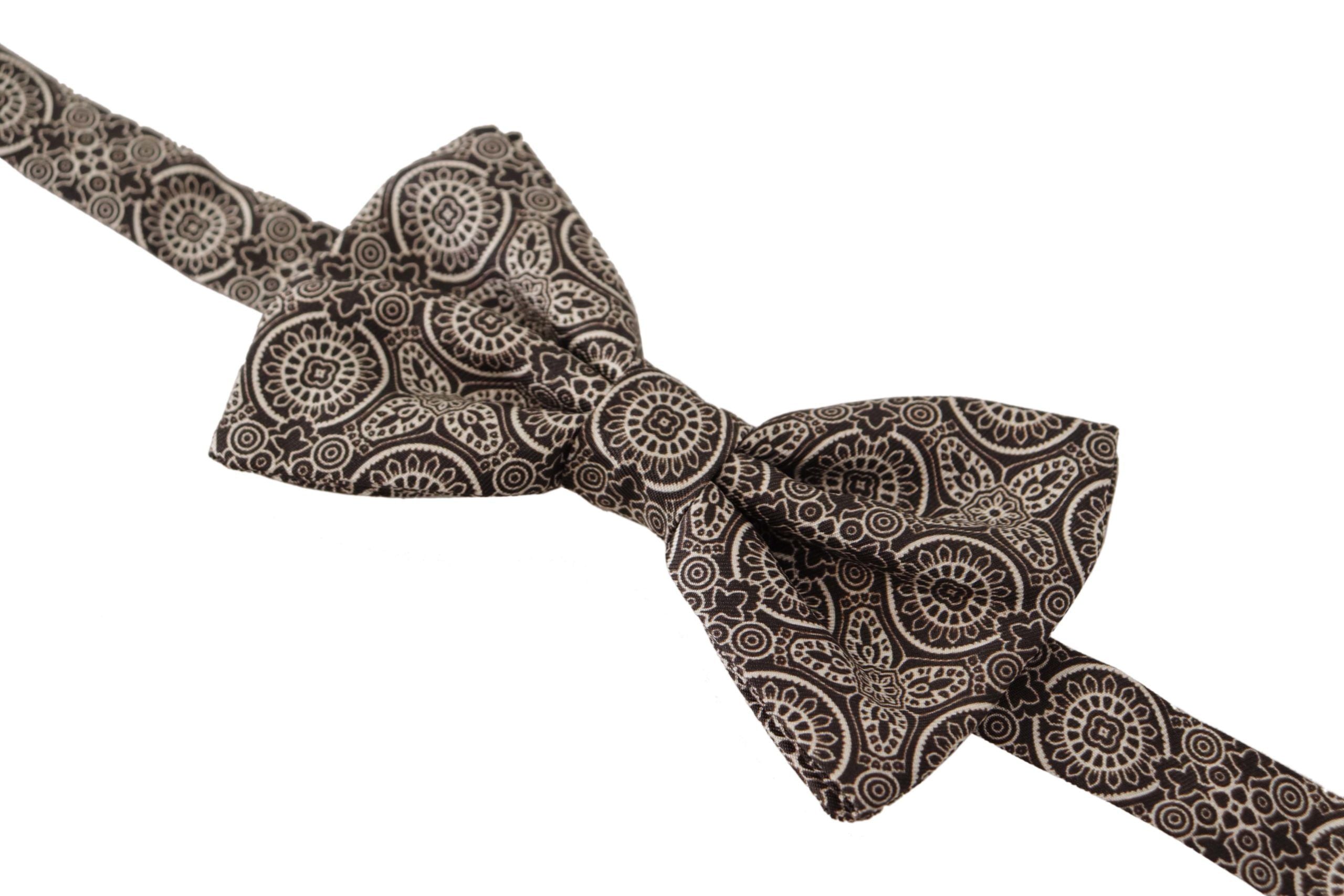 Black and white 100% silk adjustable neck papillon tie by Dolce & Gabbana, featuring a sleek, elegant bow design.
