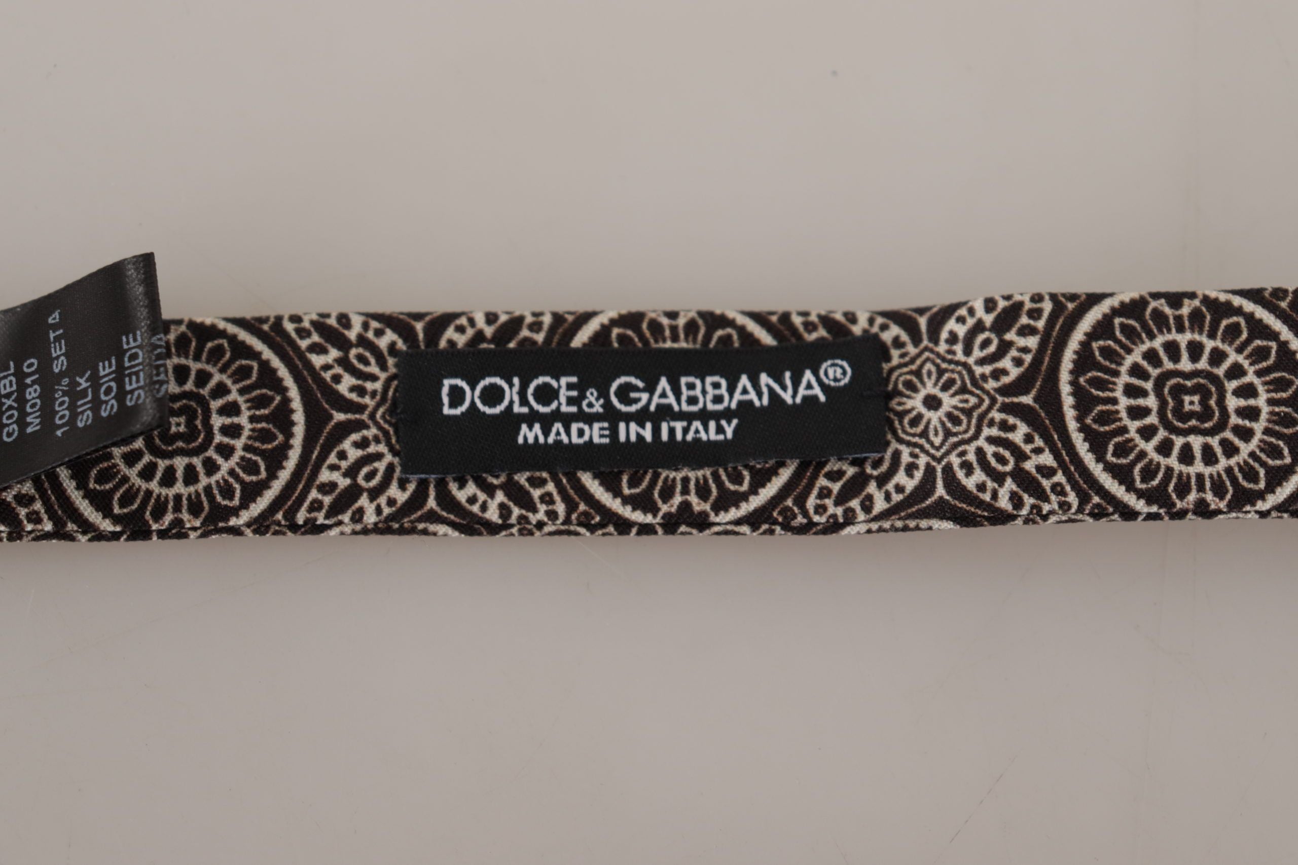 Black and white 100% silk adjustable neck papillon tie by Dolce & Gabbana, featuring a stylish bow design.