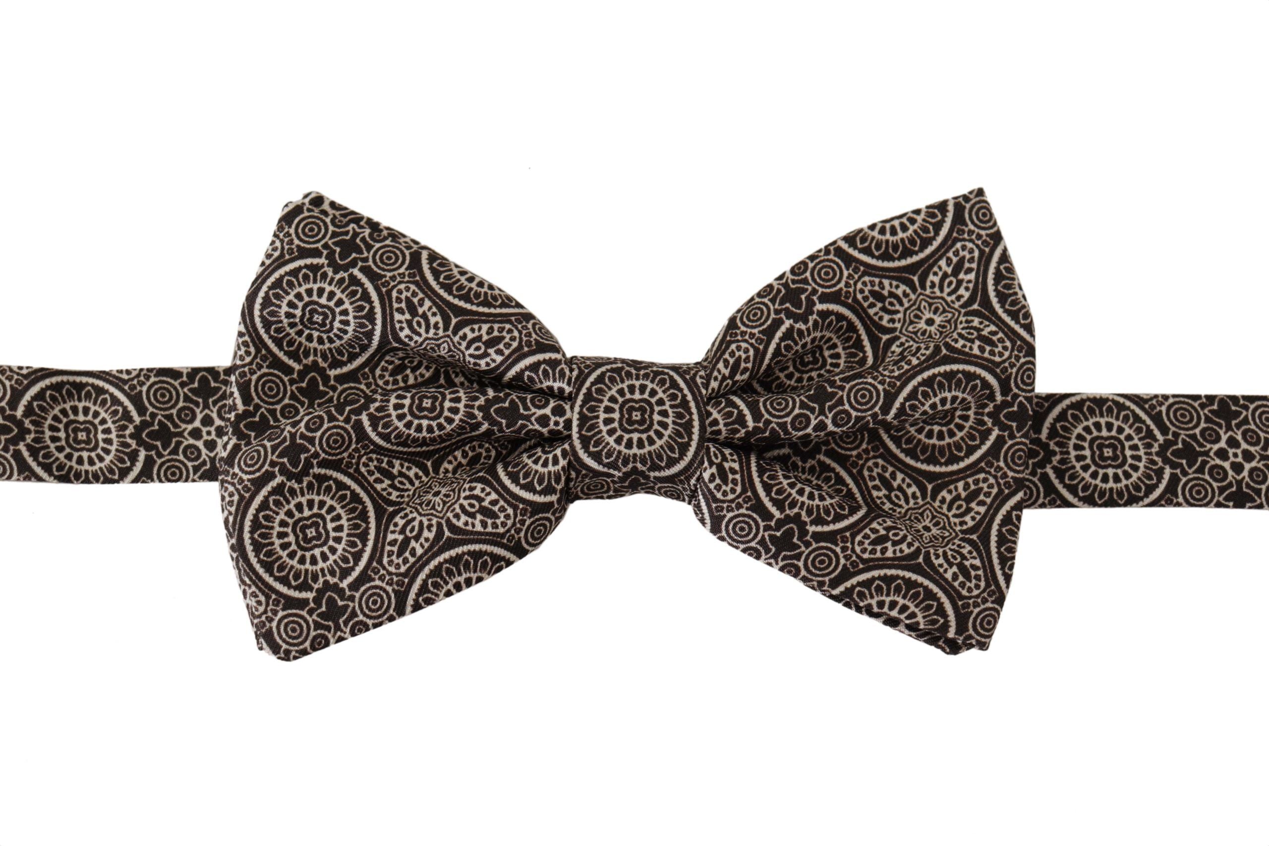 Black and white 100% silk adjustable neck papillon tie by Dolce & Gabbana, featuring a classic bow design.