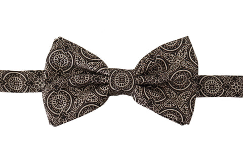 Black and white 100% silk adjustable neck papillon tie by Dolce & Gabbana, featuring a classic bow design.