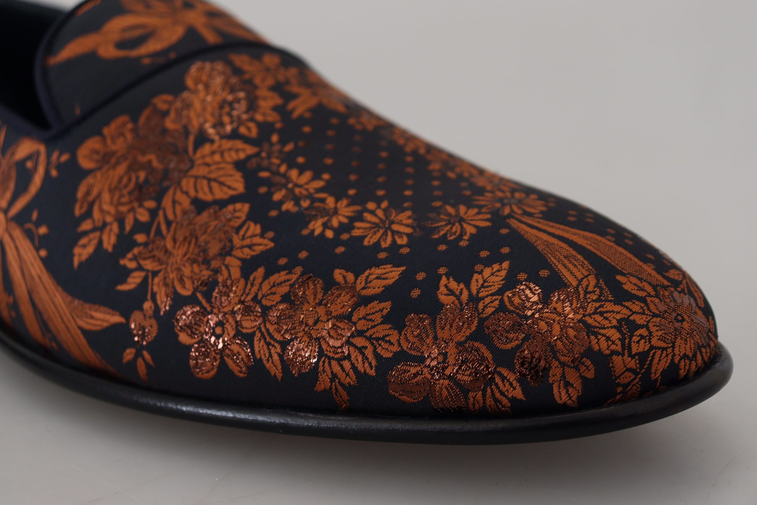 Blue rust floral Dolce & Gabbana slippers loafers with embroidered floral design and comfortable slip-on style.