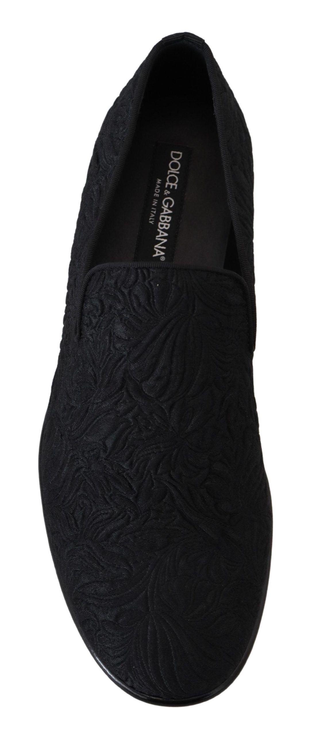 Black floral jacquard slippers loafers by Dolce & Gabbana with intricate floral pattern and sleek slip-on design.