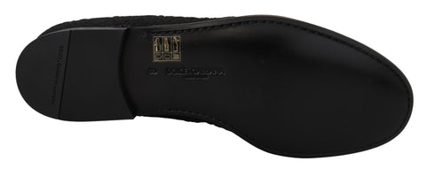 Black floral jacquard loafers by Dolce & Gabbana with slip-on design and elegant floral pattern.