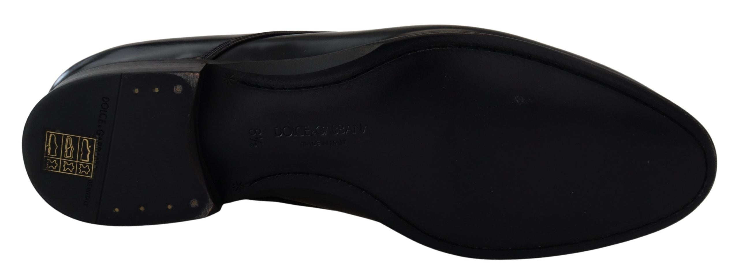 Black leather formal dress shoes by Dolce & Gabbana, sleek design with polished finish, ideal for elegant occasions.