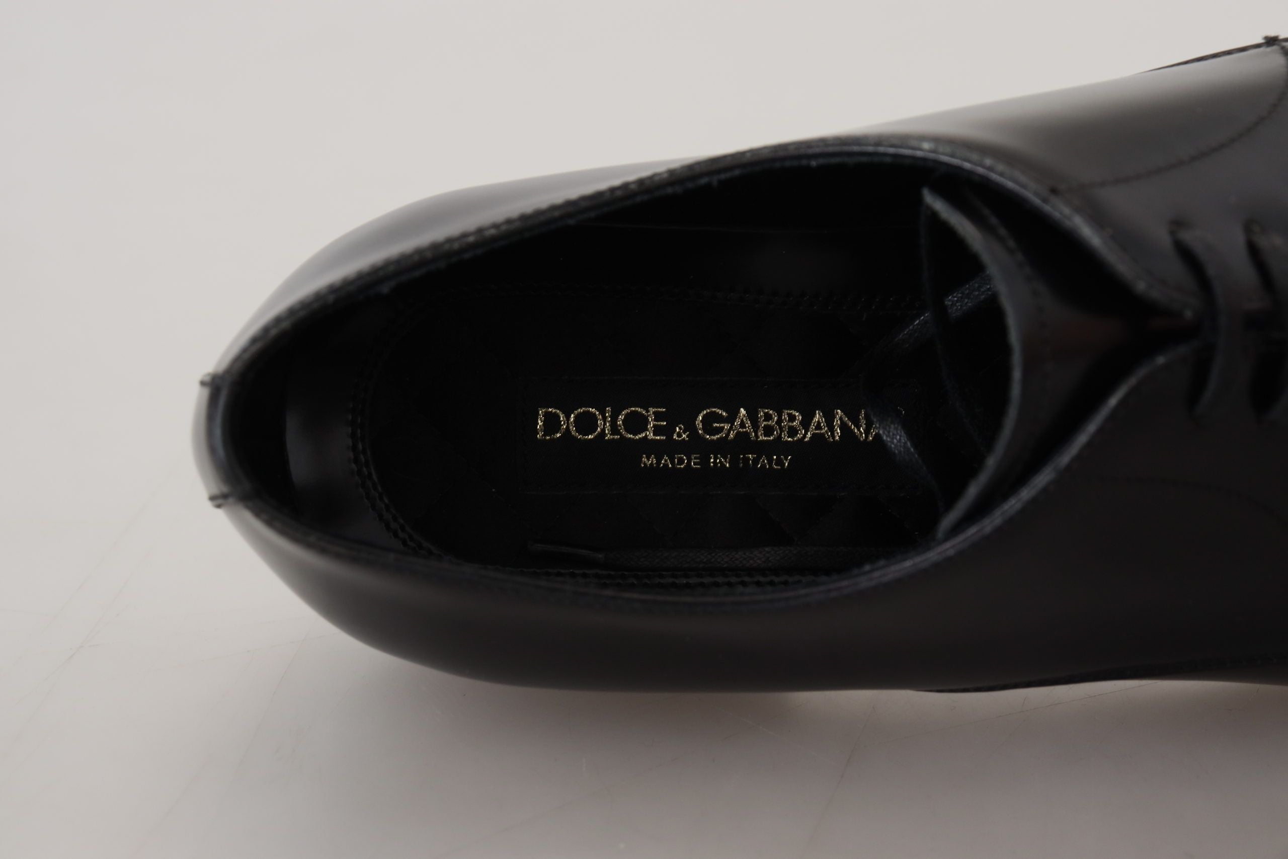Black leather formal dress shoes by Dolce & Gabbana, sleek design with polished finish and classic lace-up style.