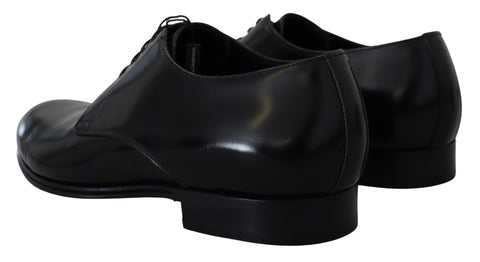 Black leather formal dress shoes by Dolce & Gabbana, sleek design with polished finish and classic lace-up style.