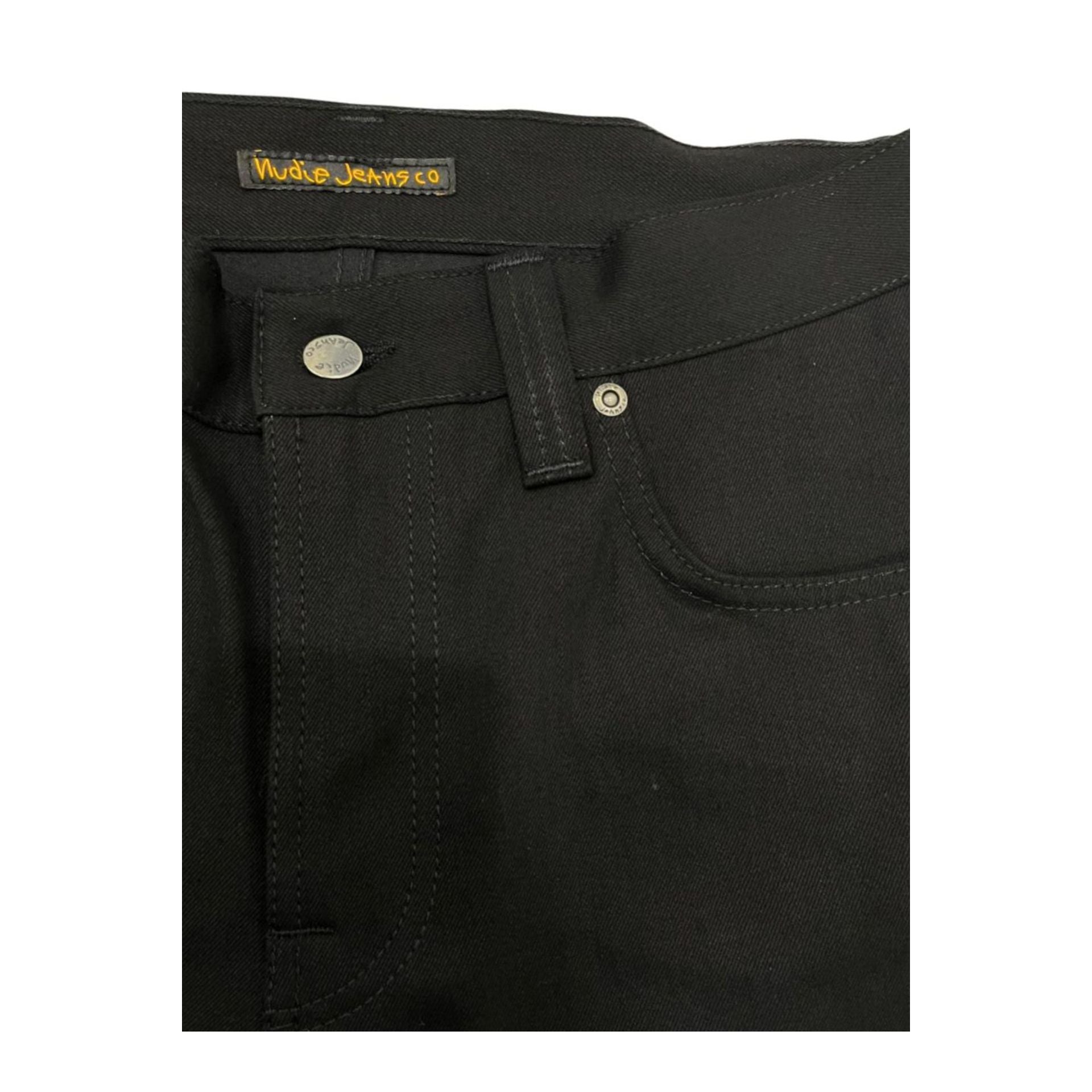 Nudie Jeans NJ3088 SlimJim black denim jeans displayed on a model, showcasing slim fit and classic five-pocket design.