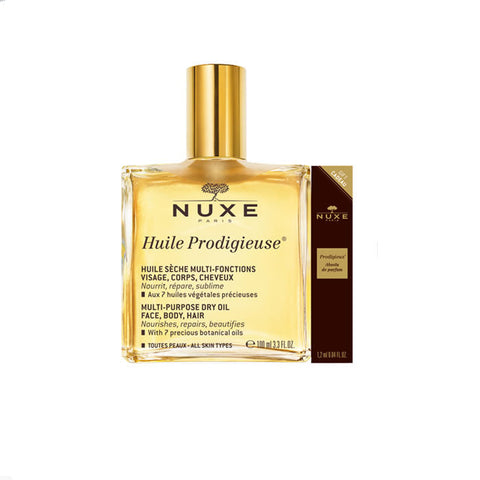 Two bottles of Nuxe Huile Prodigieuse dry oil by Jag Couture London, 100ml each, showing the elegant packaging and product details.