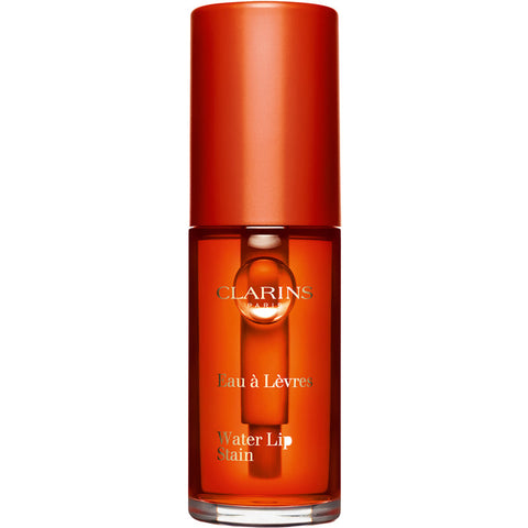 Jag Couture London new York Clarins Water Lip Stain in shade 02 Orange Water, featuring a vibrant orange lip color on model