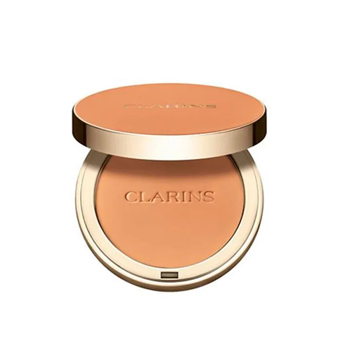 Jag Couture London Ever Matte Compact Powder in 05 Medium Deep, featuring Clarins branding, with a smooth pressed powder surface.