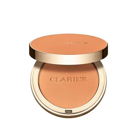 Jag Couture London Ever Matte Compact Powder in 05 Medium Deep, featuring Clarins branding, with a smooth pressed powder surface.