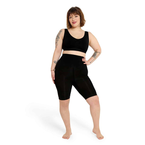 Black Bodyboo BB2070 bodysuit by Jag Couture London - New York, shown on a model with sleek, fitted design and long sleeves.