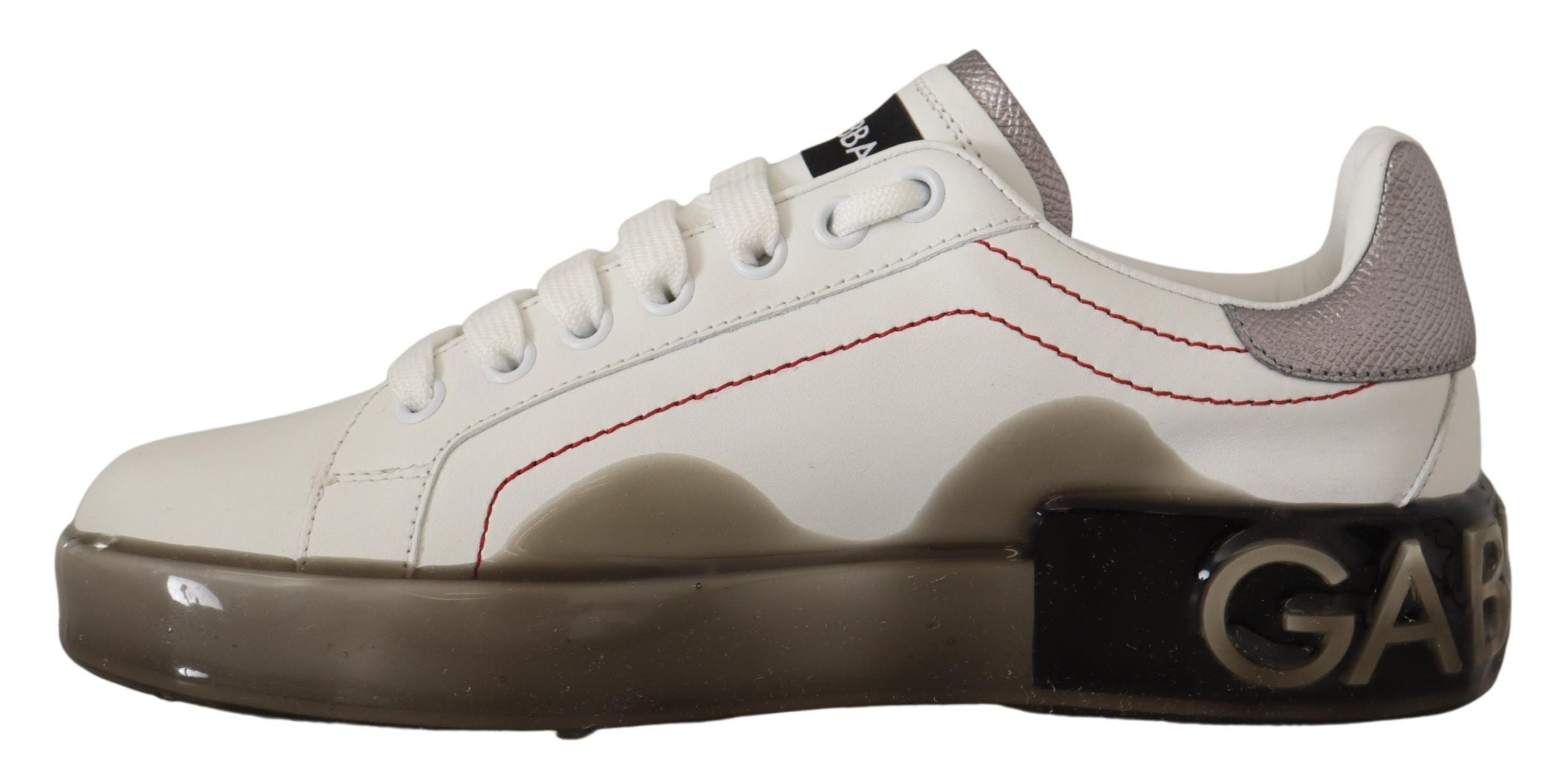 White leather women's sneakers with Dolce & Gabbana logo on the side, stylish Portofino sneakers for casual wear.