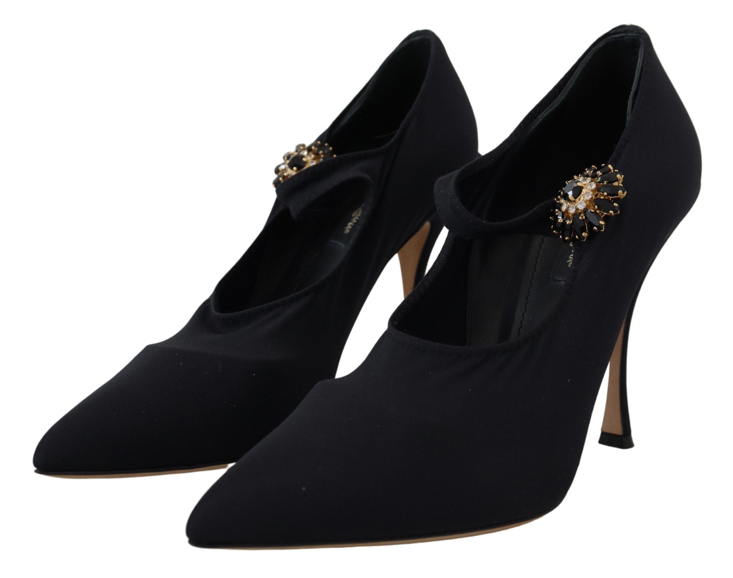 Black Dolce & Gabbana stretch crystal pumps with black socks, showcasing elegant footwear with embellished details.