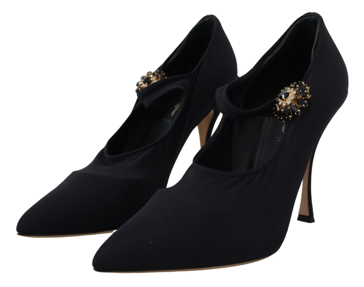 Black Dolce & Gabbana stretch crystal pumps with black socks, showcasing elegant footwear with embellished details.