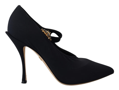 Black stretch crystal pumps shoes with black socks, designed by Dolce & Gabbana, featuring elegant pointed heels and decorative crystal accents.