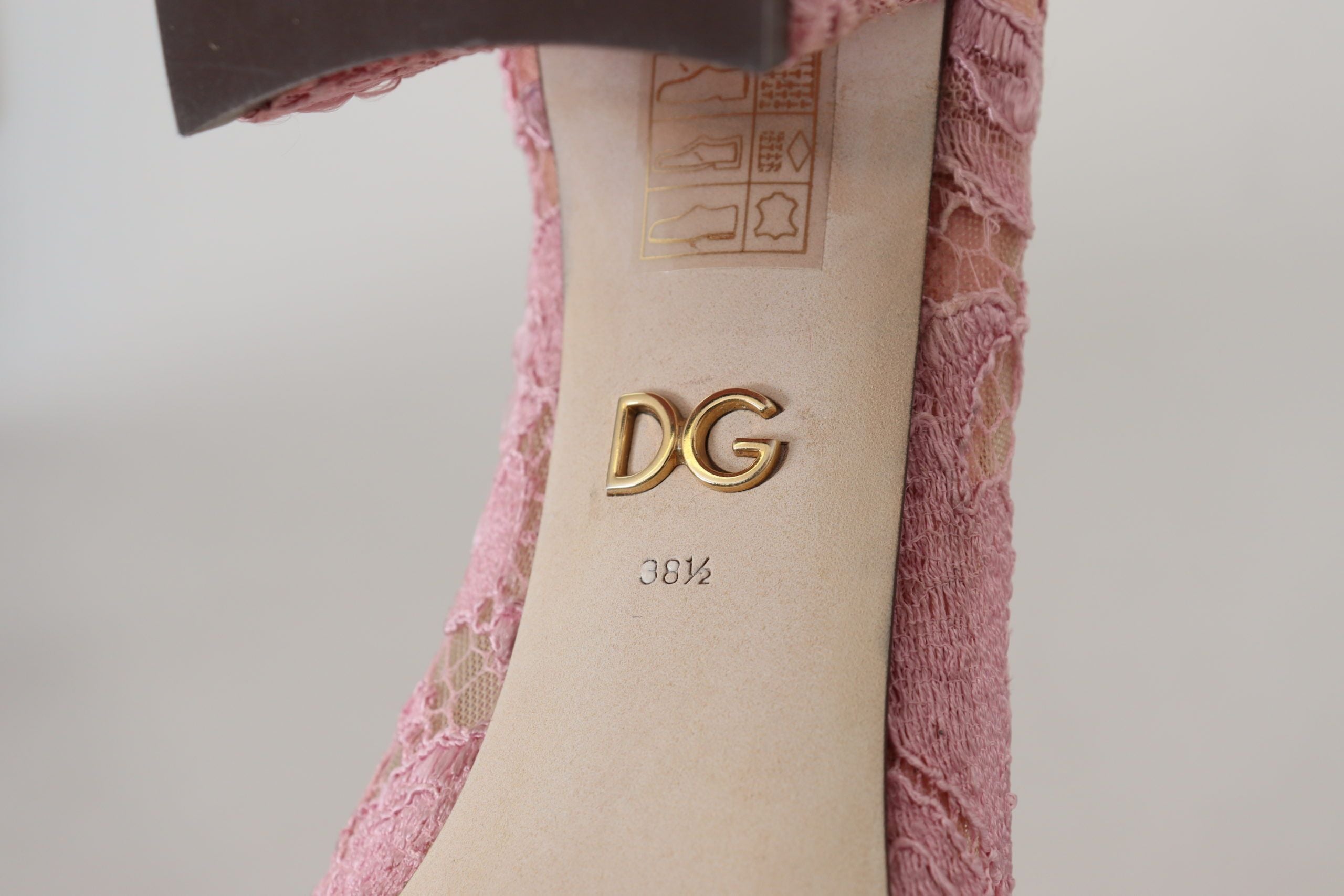 Pink Taormina Lace Crystal Pumps by Dolce & Gabbana featuring pastel-colored lace and sparkling crystal embellishments.