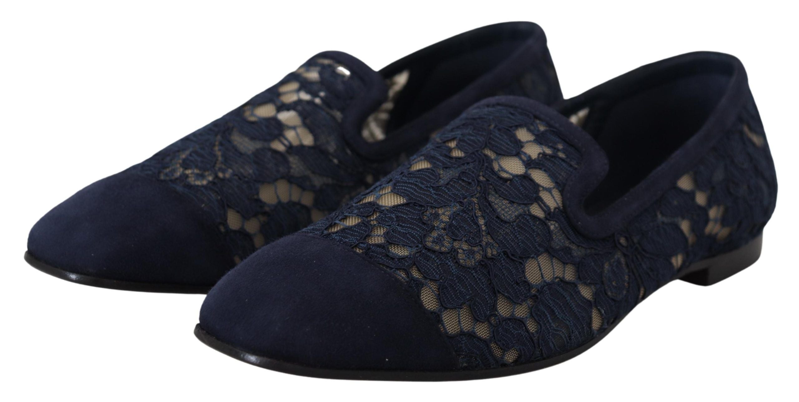 Blue floral lace slip-on loafers from Dolce & Gabbana, featuring intricate lace details and a sleek flat shoe design.