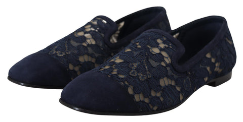 Blue floral lace slip-on loafers from Dolce & Gabbana, featuring intricate lace details and a sleek flat shoe design.