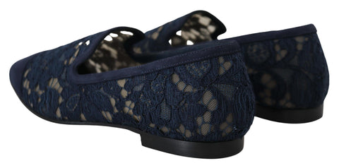 Blue floral lace slip-on loafers by Dolce & Gabbana featuring floral lace detailing and a classic flat shoe design.