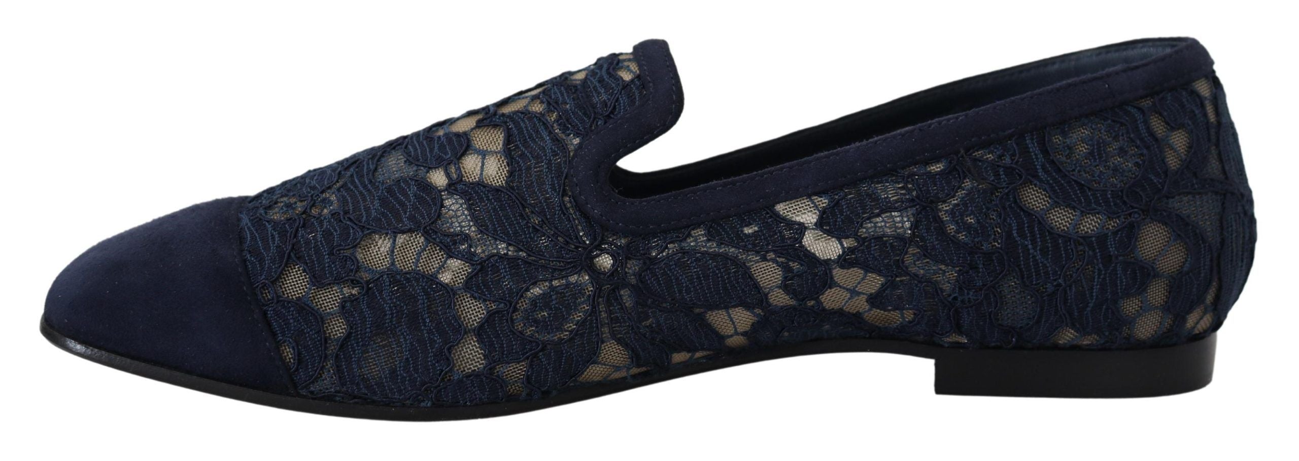 Blue floral lace slip-on loafers from Dolce & Gabbana with intricate lace detailing and a sleek flat shoe design.
