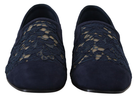 Blue floral lace slip-on loafers from Dolce & Gabbana with intricate lace detailing and a sleek flat shoe design.