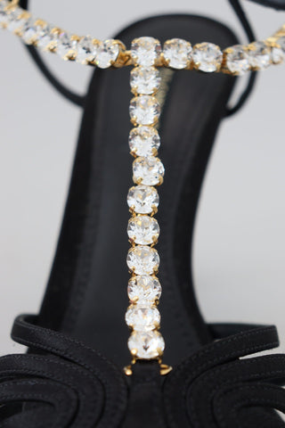 Black satin T-strap sandal shoes with clear crystal embellishments from Dolce & Gabbana, stylish footwear for elegant occasions.