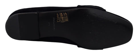 Black velvet loafers with crystal embellishments by Dolce & Gabbana, featuring a sleek slip-on design and elegant detailing.