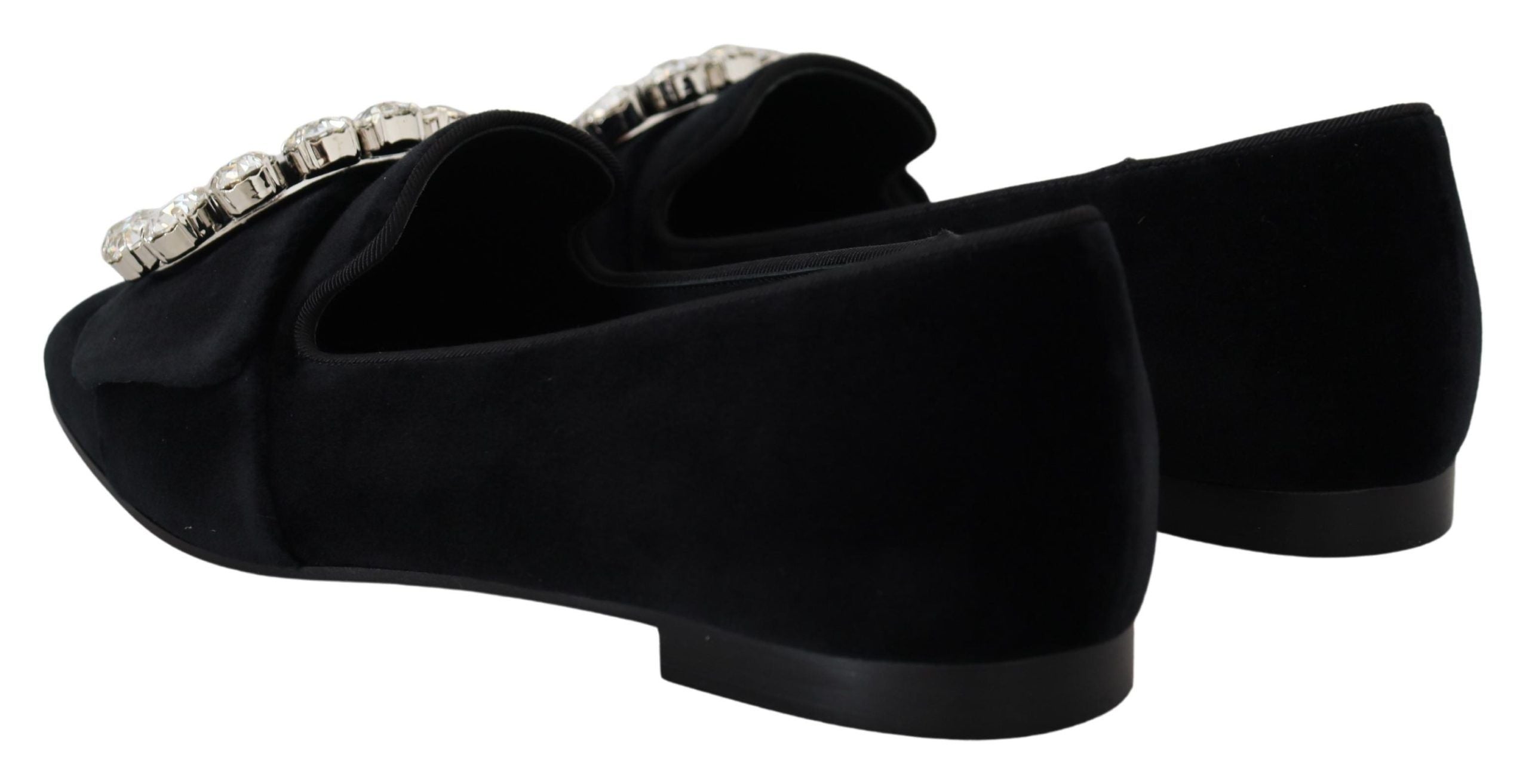 Black velvet loafers with crystal embellishments from Dolce & Gabbana featuring a sleek, elegant flat shoe design.