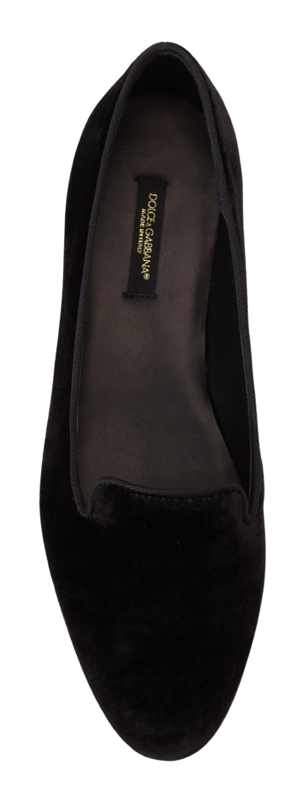 Black velvet Dolce & Gabbana slip-on loafers with sleek flat design and pointed toes, perfect for elegant casual wear.
