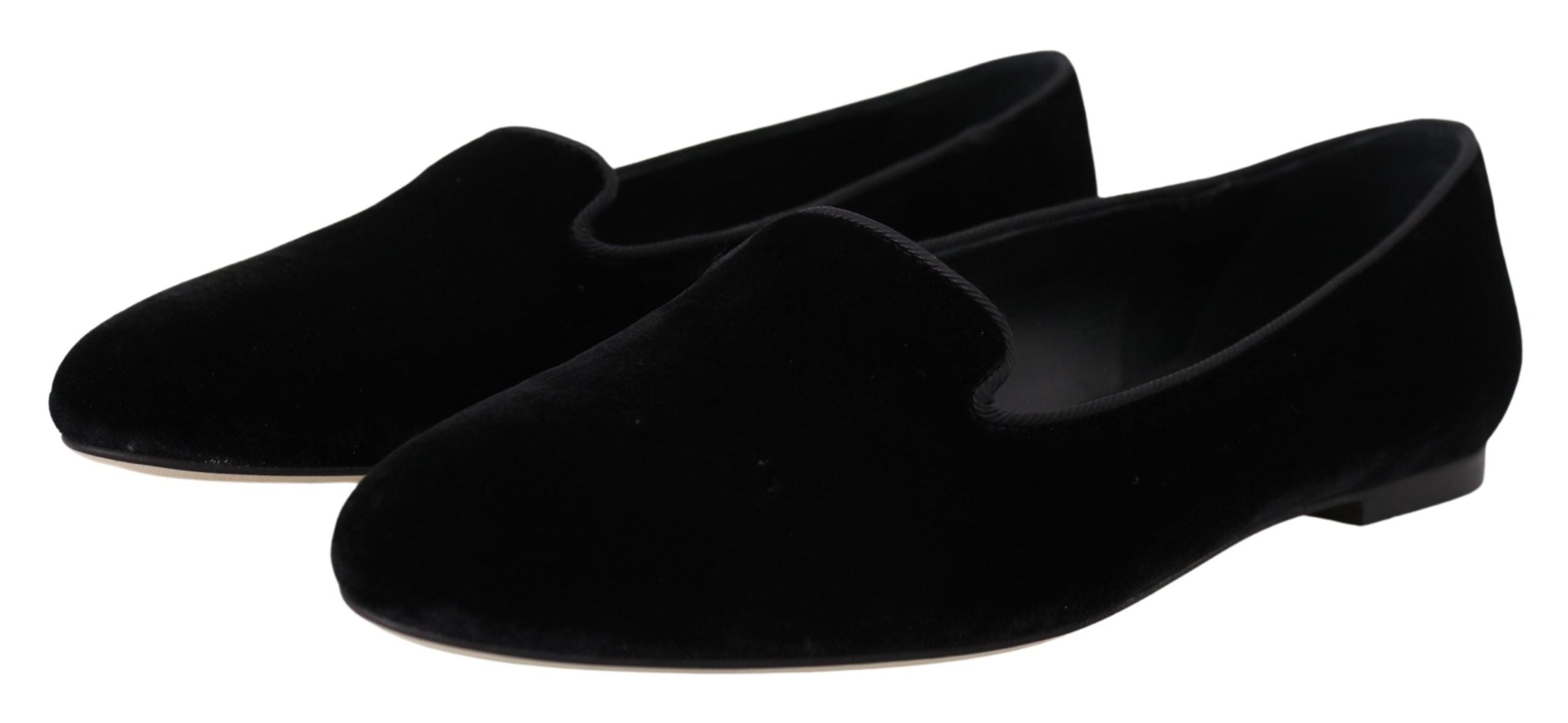 Black velvet slip-on loafers by Dolce & Gabbana, showcasing sleek flats with a smooth, elegant design and rounded toe.