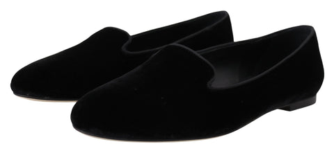 Black velvet slip-on loafers by Dolce & Gabbana, showcasing sleek flats with a smooth, elegant design and rounded toe.
