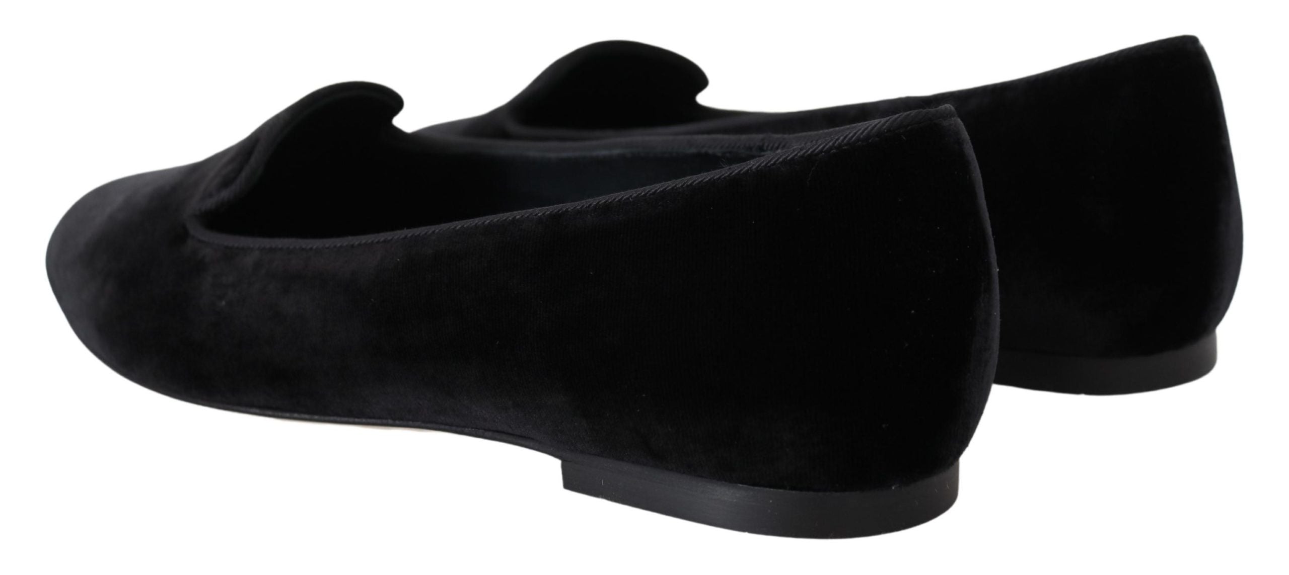Black velvet slip-on loafers by Dolce & Gabbana, showcasing sleek design and elegant flat shoes for casual or formal wear.