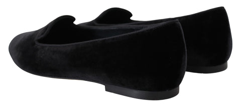 Black velvet slip-on loafers by Dolce & Gabbana, showcasing sleek design and elegant flat shoes for casual or formal wear.