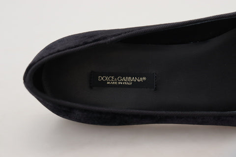 Black velvet slip-on loafers by Dolce & Gabbana, stylish flats with sleek design and smooth texture.
